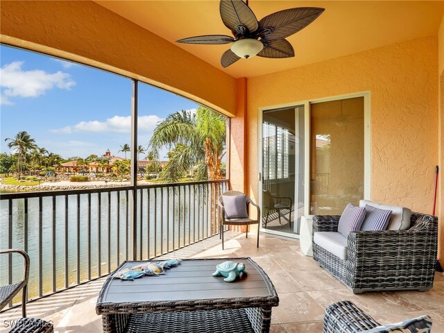 8532 Via Lungomare Cir Unit 203, Estero, FL 33928 - sunroom with ceiling fan and a water view