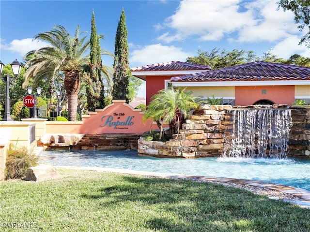 8532 Via Lungomare Cir Unit 203, Estero, FL 33928 - community sign featuring a yard