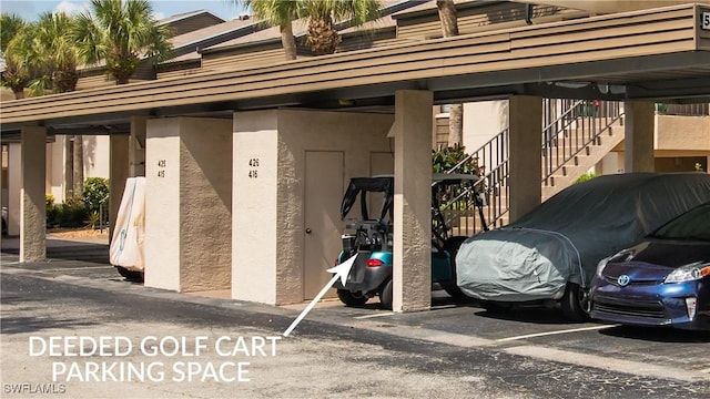 5825 Trailwinds Dr Unit 425, Fort Myers, FL 33907 - covered parking lot with stairway