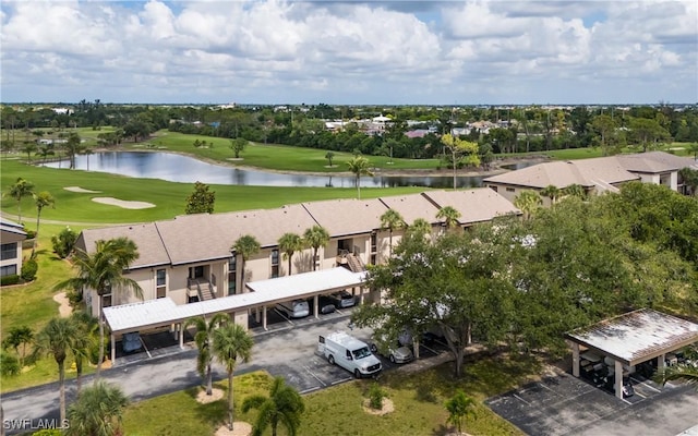 5825 Trailwinds Dr Unit 425, Fort Myers, FL 33907 - bird's eye view of a golf course, a large body of water, and a tree filled landscape