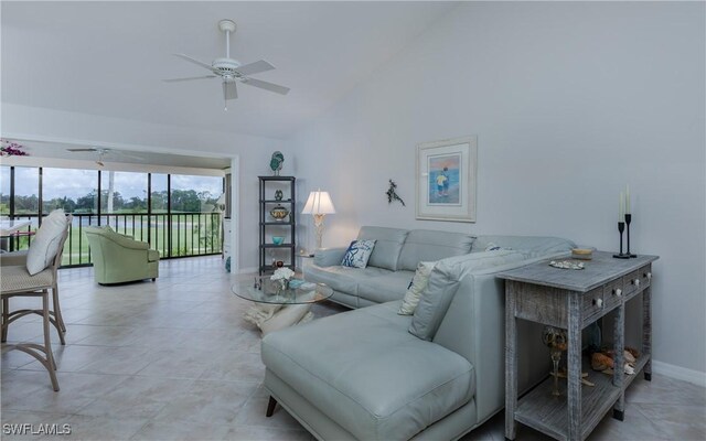 5825 Trailwinds Dr Unit 425, Fort Myers, FL 33907 - living room with a ceiling fan, baseboards, high vaulted ceiling, and light tile patterned floors