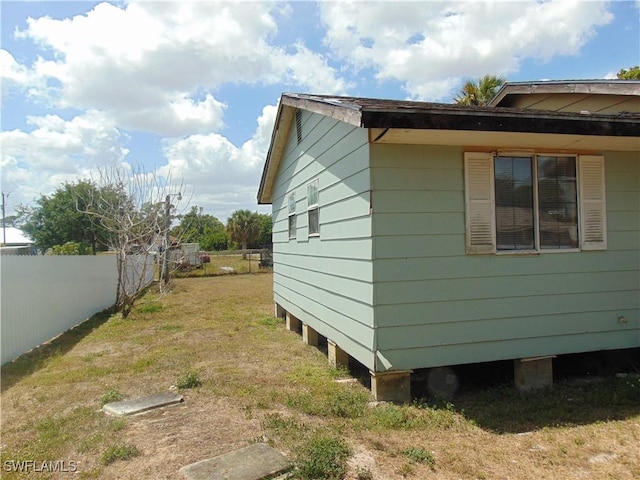 view of property exterior featuring fence