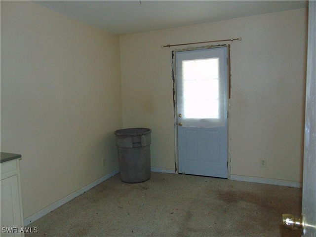 empty room with baseboards