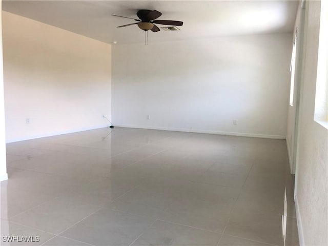 5615 Birdsong Ln, Bokeelia, FL 33922 - unfurnished room with ceiling fan and tile patterned floors
