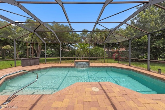 outdoor pool featuring glass enclosure and a patio
