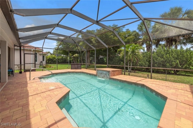 swimming pool with a patio and glass enclosure