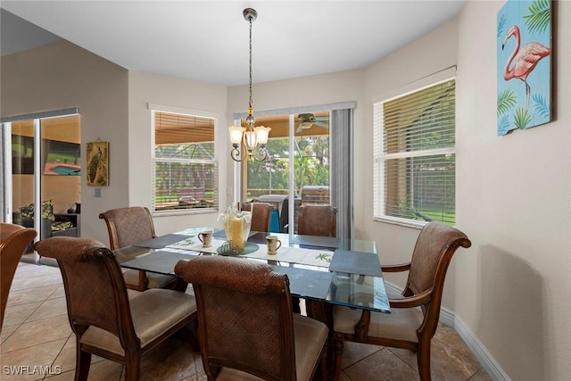 dining room featuring light tile patterned flooring and baseboards