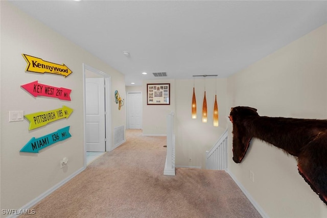 corridor featuring an upstairs landing, carpet floors, recessed lighting, and baseboards