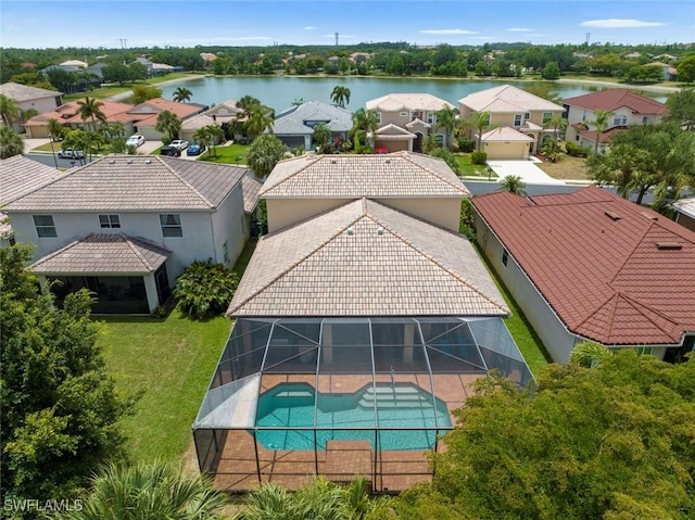 aerial view of residential area featuring a large body of water