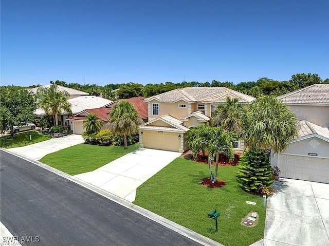 12914 Stone Tower Loop, Fort Myers, FL 33913 - view of front facade featuring driveway, a garage, a front lawn, and a residential view