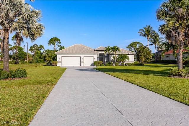 4081 Marianne Key Rd, Punta Gorda, FL 33955 - view of front of property featuring concrete driveway, a garage, a front lawn, and stucco siding