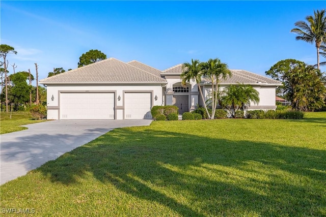 4081 Marianne Key Rd, Punta Gorda, FL 33955 - mediterranean / spanish-style house featuring an attached garage, a front yard, stucco siding, concrete driveway, and a tile roof