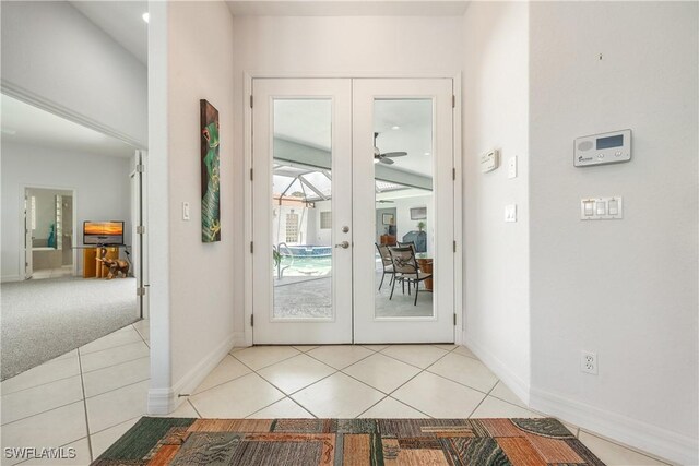 4081 Marianne Key Rd, Punta Gorda, FL 33955 - doorway to outside featuring a ceiling fan, french doors, tile patterned floors, and baseboards
