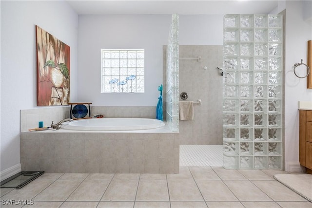 4081 Marianne Key Rd, Punta Gorda, FL 33955 - bathroom with tile patterned flooring, a walk in shower, a garden tub, and vanity