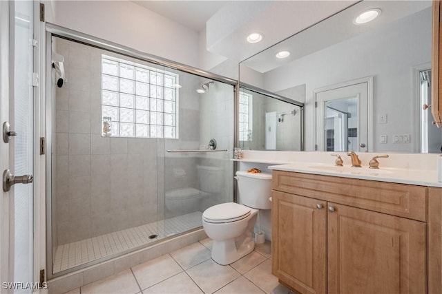 4081 Marianne Key Rd, Punta Gorda, FL 33955 - bathroom featuring toilet, tile patterned floors, a stall shower, vanity, and recessed lighting