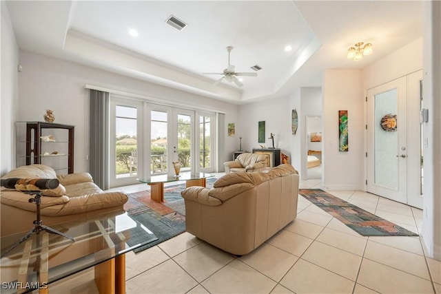4081 Marianne Key Rd, Punta Gorda, FL 33955 - living area featuring a raised ceiling, a ceiling fan, light tile patterned flooring, recessed lighting, and baseboards