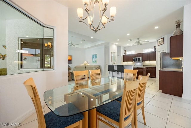 4081 Marianne Key Rd, Punta Gorda, FL 33955 - dining space featuring a ceiling fan, light tile patterned floors, recessed lighting, and a chandelier
