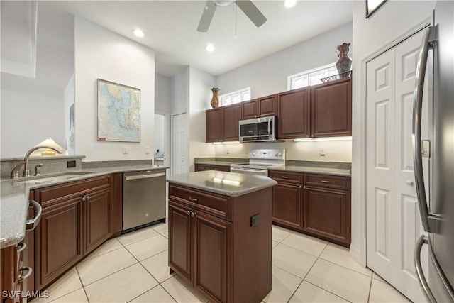 4081 Marianne Key Rd, Punta Gorda, FL 33955 - kitchen featuring stainless steel appliances, a sink, a ceiling fan, light tile patterned floors, and recessed lighting