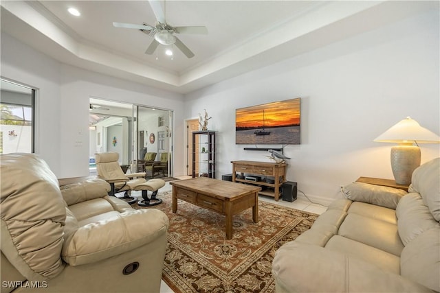 4081 Marianne Key Rd, Punta Gorda, FL 33955 - living room featuring a ceiling fan, a raised ceiling, crown molding, tile patterned floors, and recessed lighting
