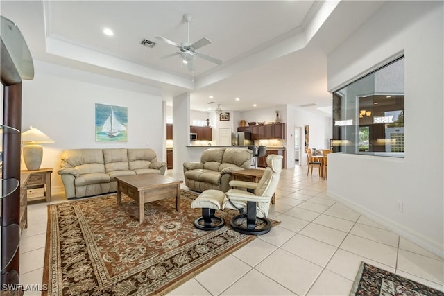 4081 Marianne Key Rd, Punta Gorda, FL 33955 - living area with light tile patterned floors, ceiling fan, recessed lighting, a raised ceiling, and baseboards