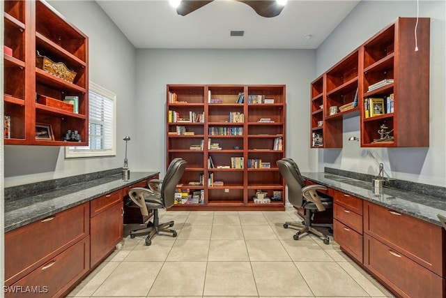 4081 Marianne Key Rd, Punta Gorda, FL 33955 - home office with built in desk and light tile patterned floors