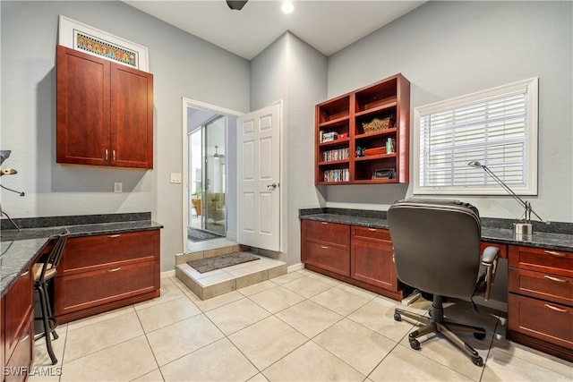 4081 Marianne Key Rd, Punta Gorda, FL 33955 - office with built in study area and light tile patterned floors