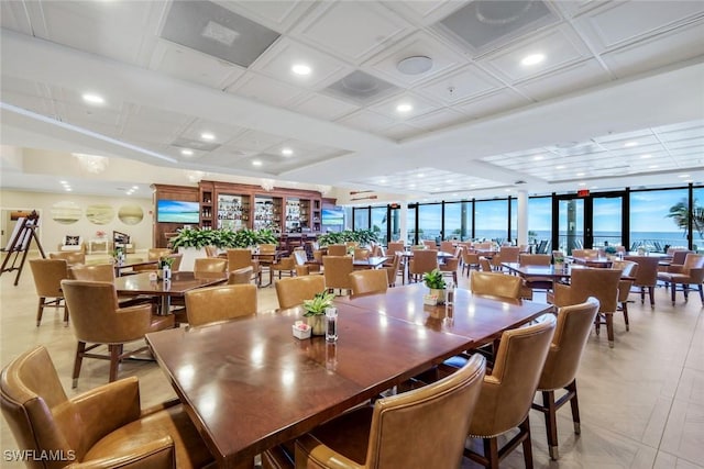 dining space featuring coffered ceiling, recessed lighting, and light tile patterned floors
