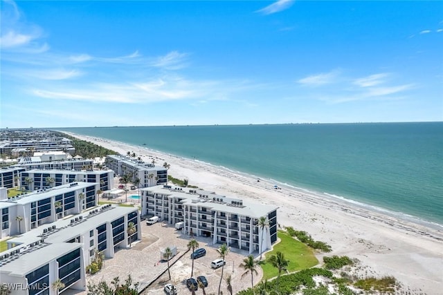 drone / aerial view of unending shoreline and apartment complex