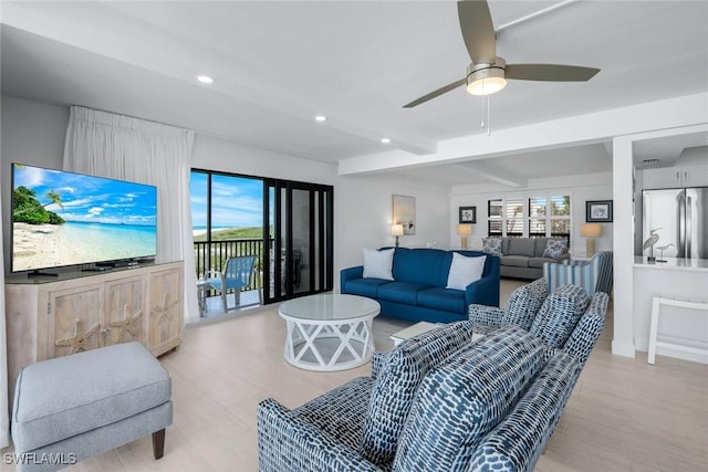 living area with recessed lighting, beam ceiling, and ceiling fan
