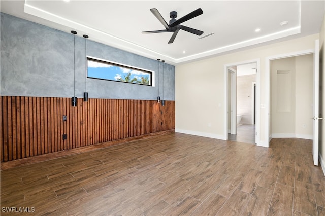 3413 NW 9th Ter, Cape Coral, FL 33993 - unfurnished room featuring a raised ceiling, wood finished floors, ceiling fan, and recessed lighting