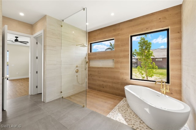 3413 NW 9th Ter, Cape Coral, FL 33993 - bathroom with a walk in shower, a soaking tub, tile patterned floors, and recessed lighting