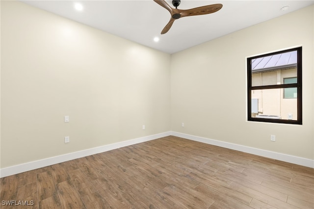 3413 NW 9th Ter, Cape Coral, FL 33993 - spare room with wood finished floors, baseboards, ceiling fan, recessed lighting, and a smoke detector