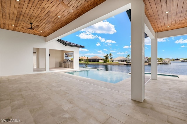 3413 NW 9th Ter, Cape Coral, FL 33993 - view of swimming pool featuring area for grilling, an infinity pool, a water view, a patio, and a ceiling fan