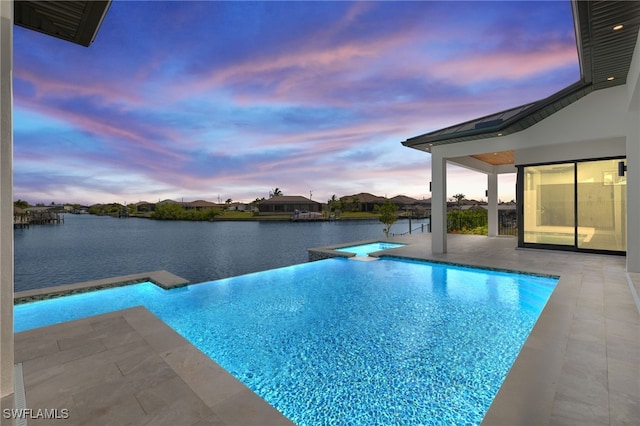3413 NW 9th Ter, Cape Coral, FL 33993 - view of swimming pool with an in-ground hot tub, an infinity pool, a patio area, and a water view