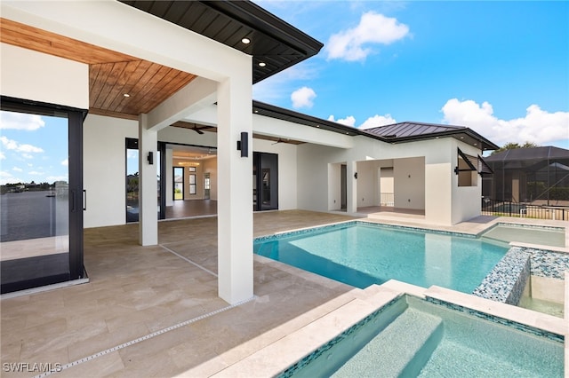 3413 NW 9th Ter, Cape Coral, FL 33993 - view of pool with ceiling fan, a pool with connected hot tub, and a patio