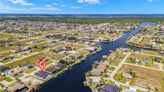 3413 NW 9th Ter, Cape Coral, FL 33993 - aerial view of property and surrounding area featuring nearby suburban area and a large body of water