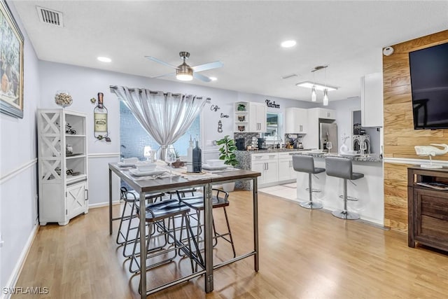 2809 50th St SW, Naples, FL 34116 - dining space with light wood-style floors, a ceiling fan, recessed lighting, and baseboards