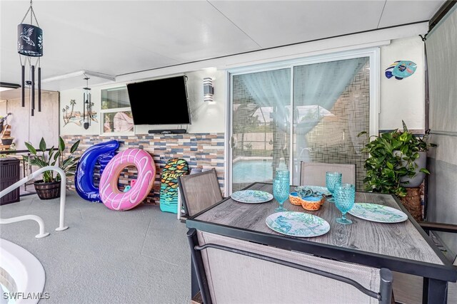 2809 50th St SW, Naples, FL 34116 - view of patio / terrace featuring outdoor dining space