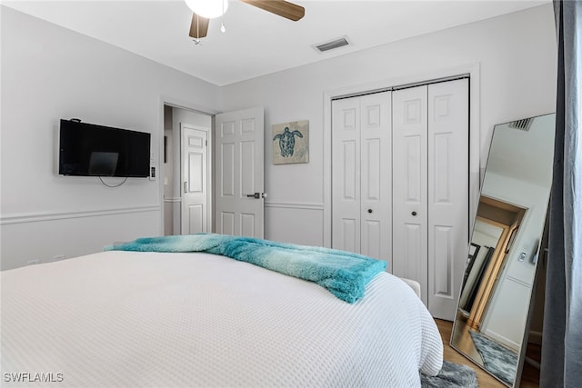 2809 50th St SW, Naples, FL 34116 - bedroom with a closet, wood finished floors, and ceiling fan