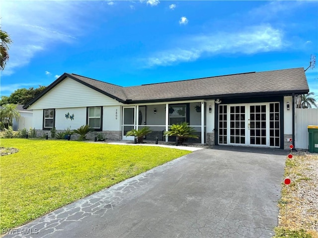 2809 50th St SW, Naples, FL 34116 - single story home with a front lawn, stone siding, and a shingled roof