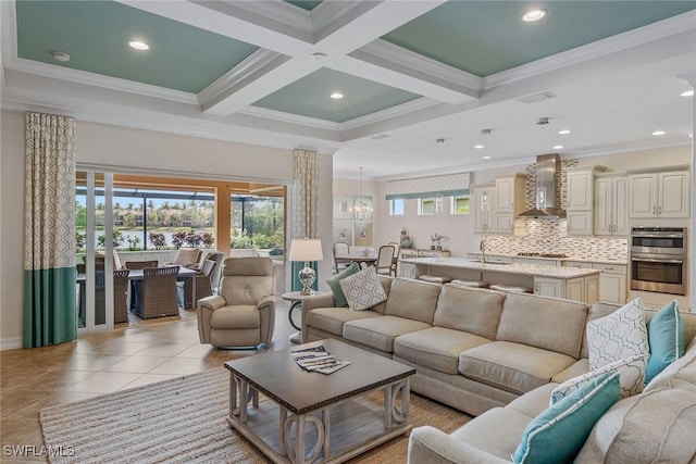 living room with beam ceiling, ornamental molding, recessed lighting, baseboards, and light tile patterned flooring