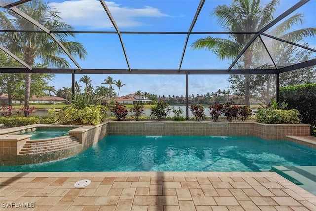 view of swimming pool with glass enclosure, a pool with connected hot tub, and a patio area