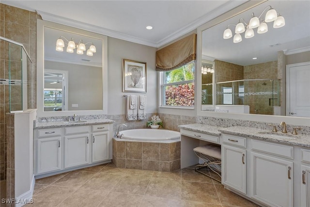 full bath with crown molding, a shower stall, two vanities, a garden tub, and tile patterned floors