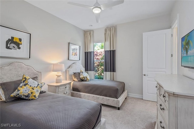bedroom with light carpet, baseboards, and ceiling fan
