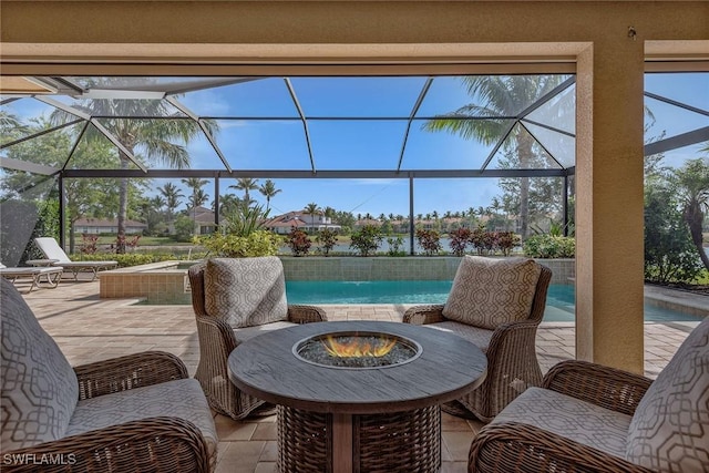view of patio with a fire pit, glass enclosure, and an outdoor pool