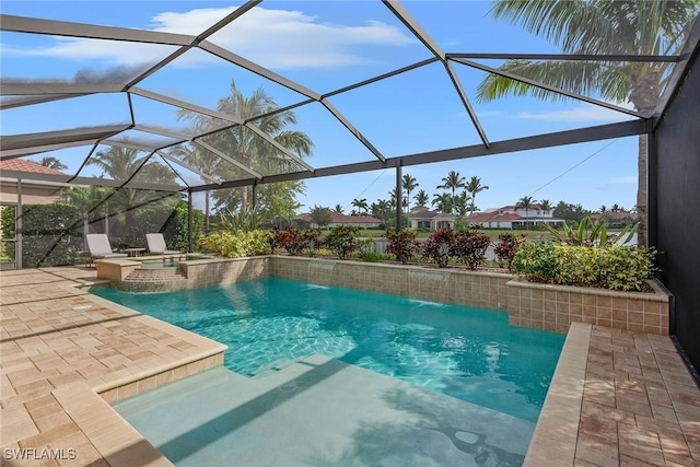 view of swimming pool with a pool with connected hot tub, a patio, and a lanai