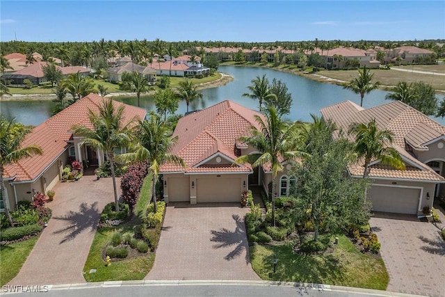 aerial view of residential area featuring a nearby body of water