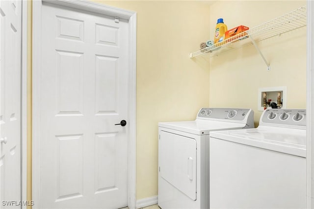 washroom with washer and dryer