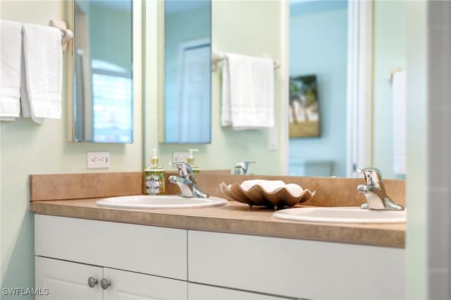 bathroom featuring double vanity