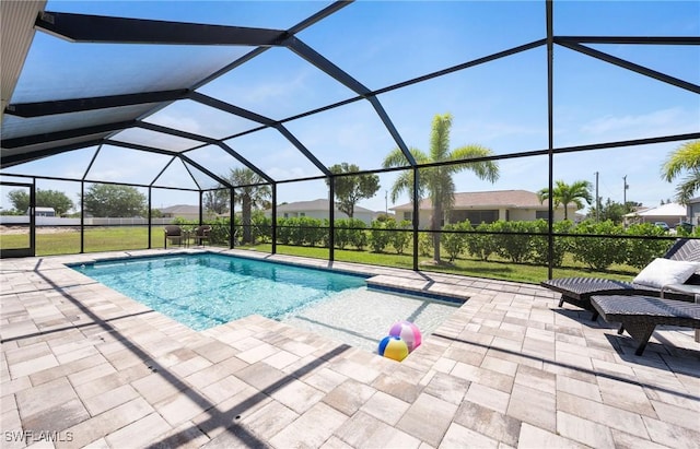 swimming pool featuring a patio area and a lanai